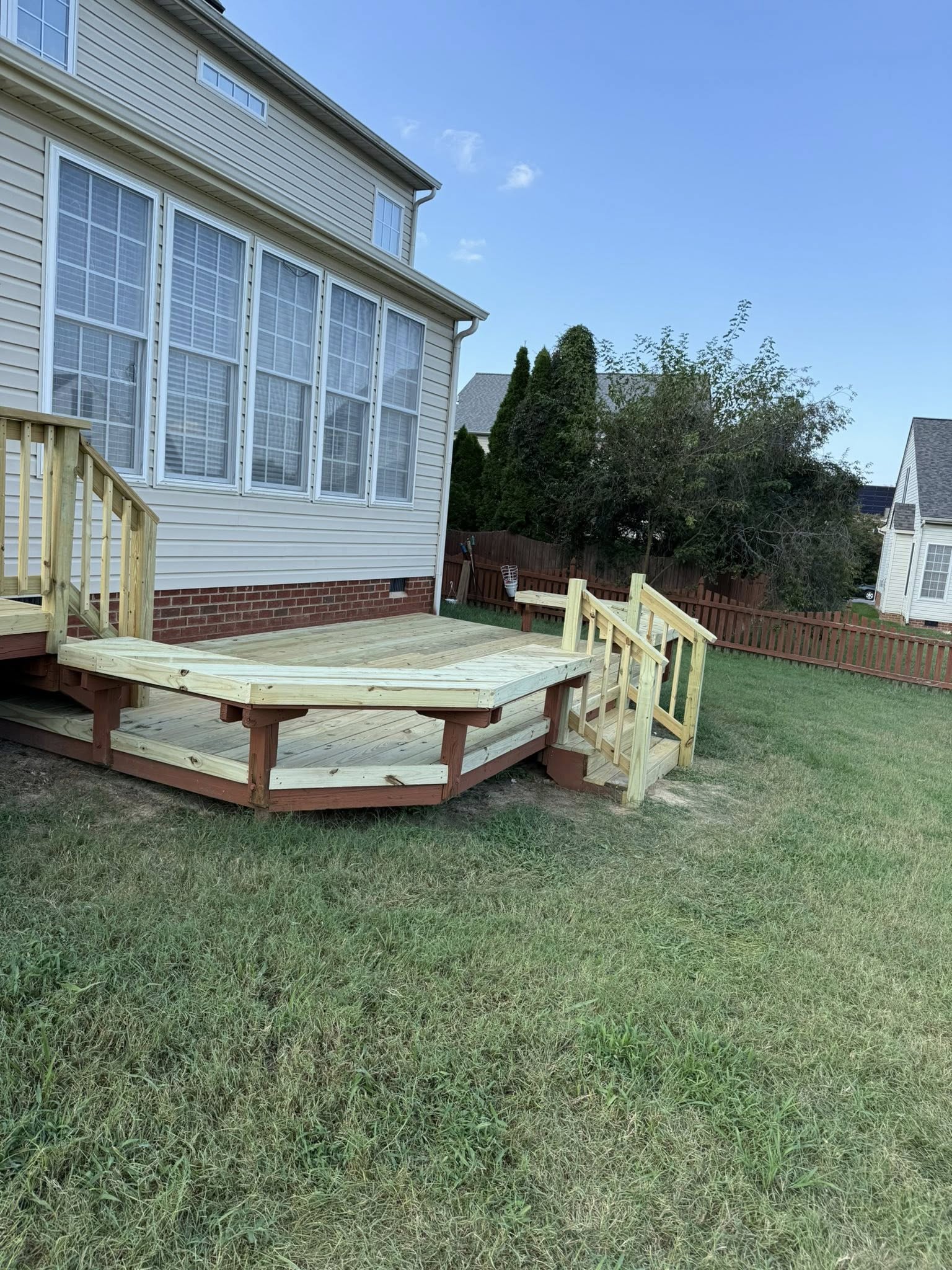 New elevated wooden deck construction with railings and stairs in Caroline County, VA